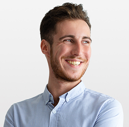 a-man-smiling-with-blue-shirt